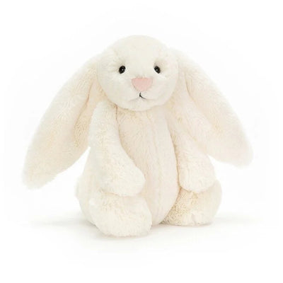 White plush bunny toy on a white background